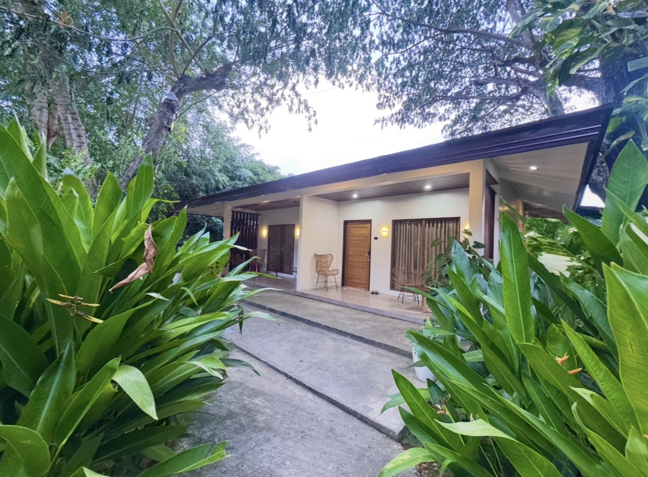 Deluxe Room exterior walkway at dusk
