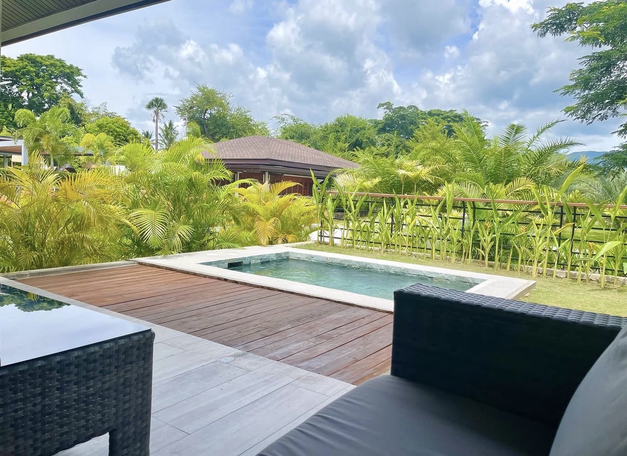 Villa A pool deck lounge with garden view